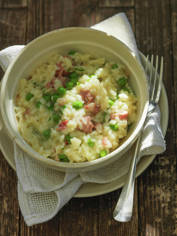 Beer Risotto With Bacon And Peas Photograph by Andreas Thumm