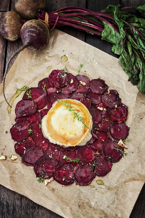 Beetroot Carpaccio With Goats Cheese On A Piece Of Baking Paper Photograph by Jan Wischnewski