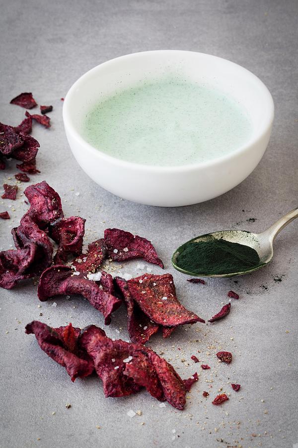 Beetroot Chips And Soya Yoghurt With Seaweed Photograph by Jan Wischnewski