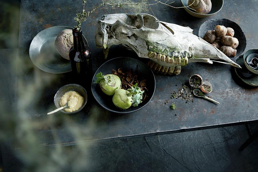 Beetroot, Kohlrabi, Celery Cream, Spices And An Animal Skull On A Table Photograph by Aina C. Hole