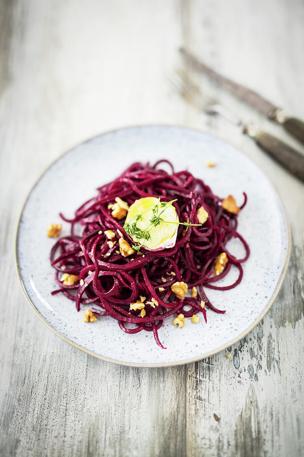 Beetroot Noodle Salad With Baked Goats Cheese, Honey And Walnuts Photograph by Jan Wischnewski