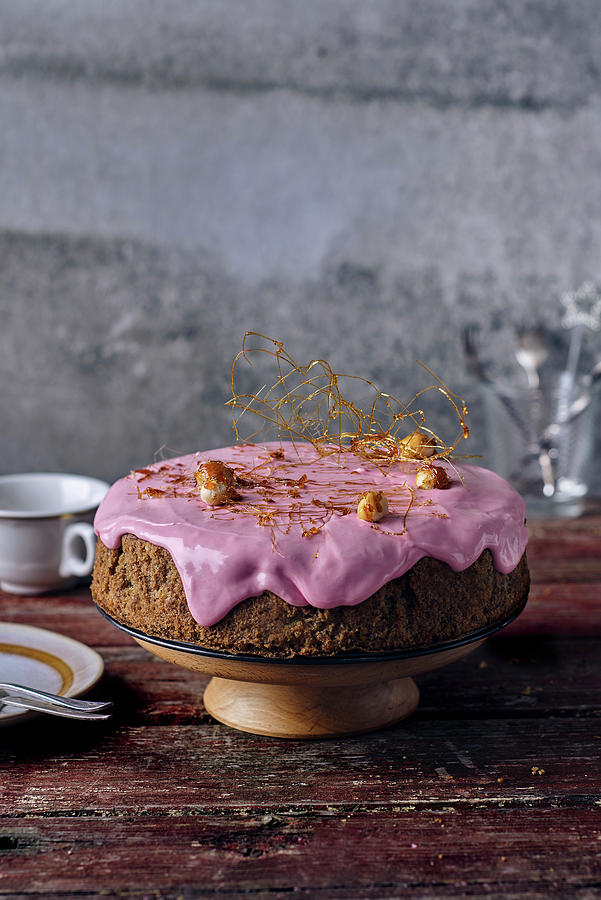 Beetroot Sponge Cake With Beetroot And Cream Cheese Frosting And Caramelised Macadamia Nuts Photograph by Angelika Grossmann