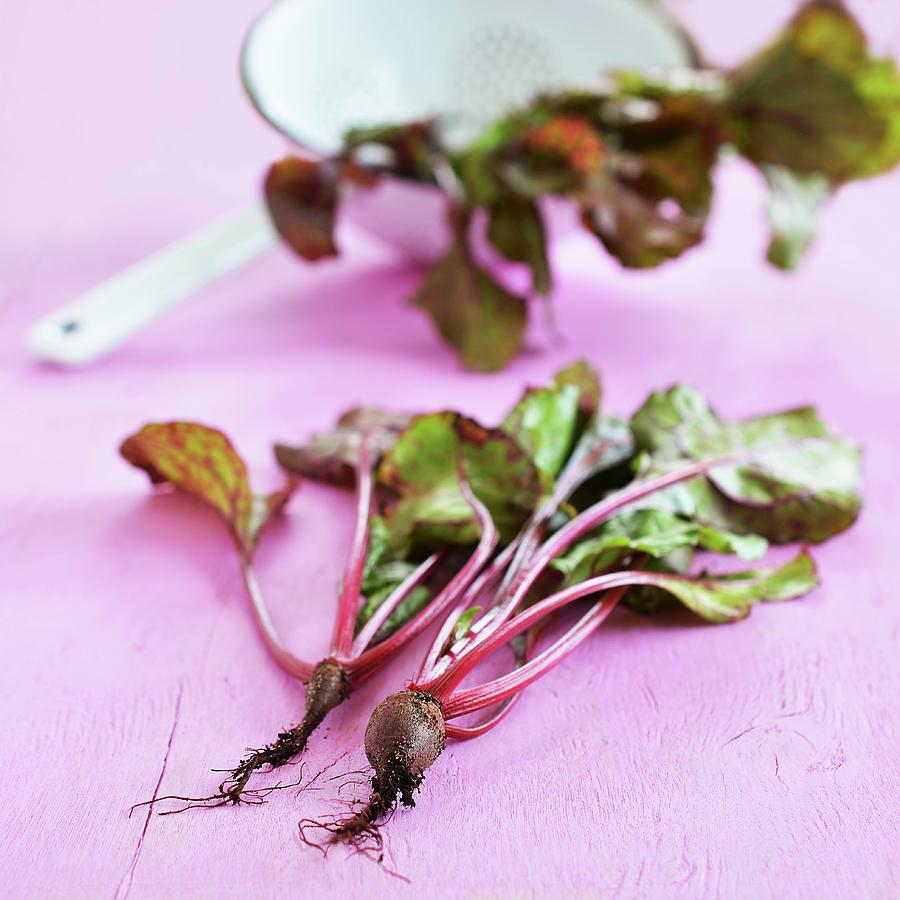 Beetroot With Roots With Fresh Leaves In A Colander In The Background Photograph by Mariola Streim