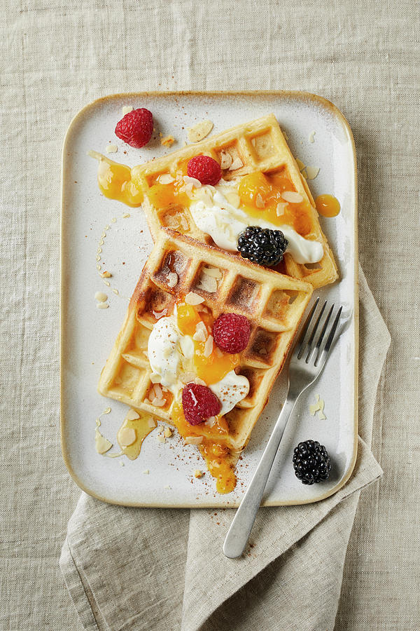 Belgian Waffles With Yogurt, Apricot Puree, Flaked Almonds, Honey, Blackberries And Raspberries Photograph by Jennifer Braun