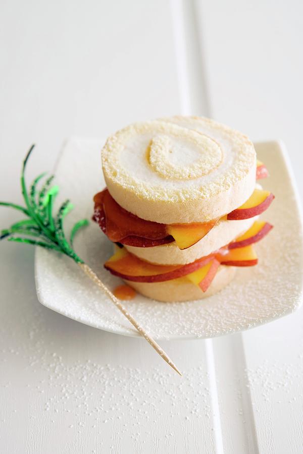 Bellini Cake Made With Swiss Roll Slices And Peaches Photograph by Michael Wissing