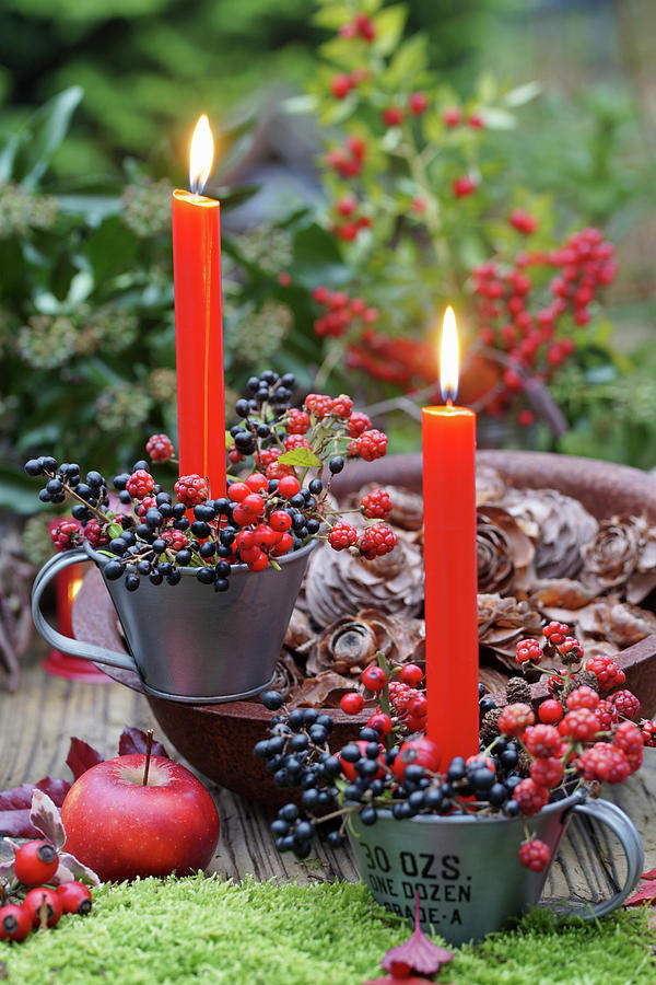 Berries And Candles As Table Decoration In Autumn Photograph by Angelica Linnhoff
