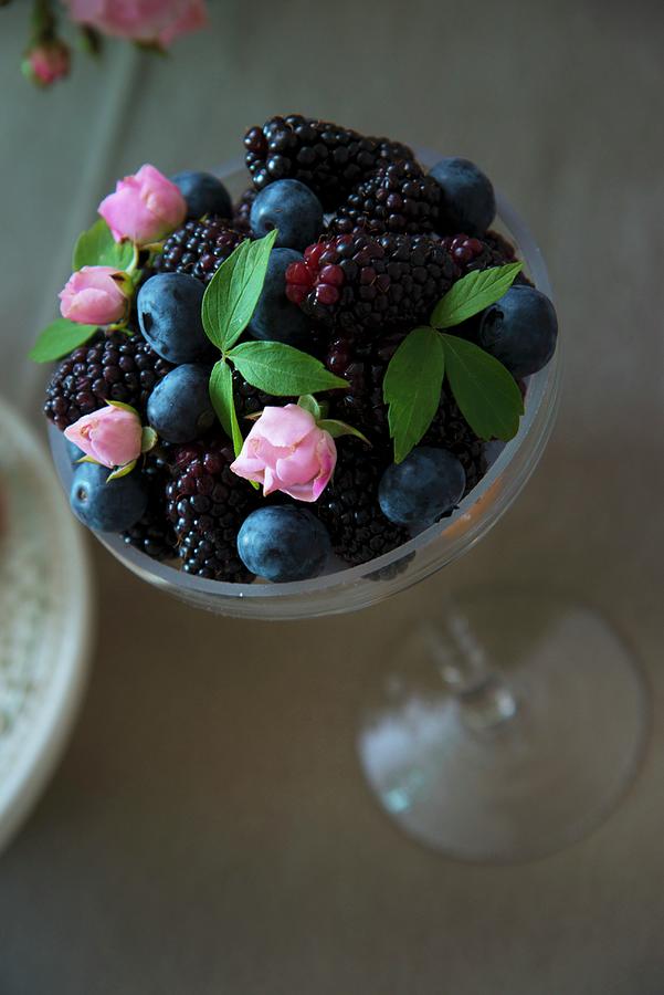 Berries And Small Rosebuds In Dessert Glass Photograph by Christophe Madamour