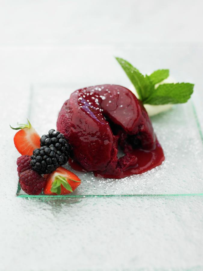 Berry Pudding With Fresh Berries On A Glass Plate Photograph by Myles New