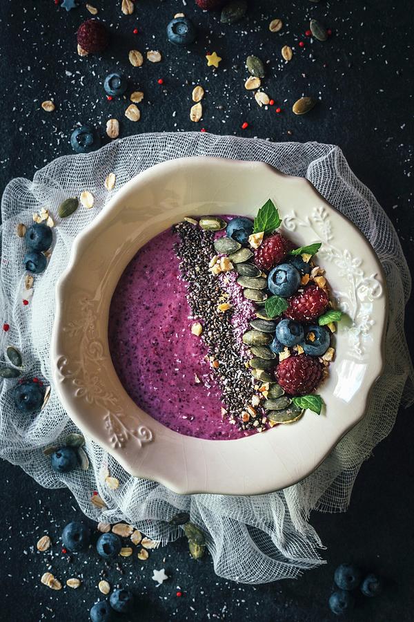 Berry Smoothie Bowl With Chia, Pumpkin Seeds And Oat Flakes Photograph by Ltummy