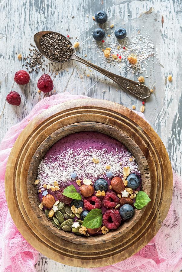 Berry Smoothie Bowl With Hazelnuts, Pumpkin Seeds And Oat Flakes Photograph by Ltummy