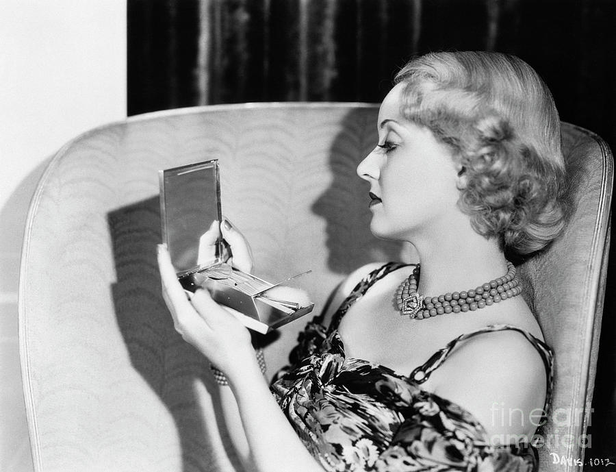 Bette Davis Looking Into Vanity Case Photograph by Bettmann