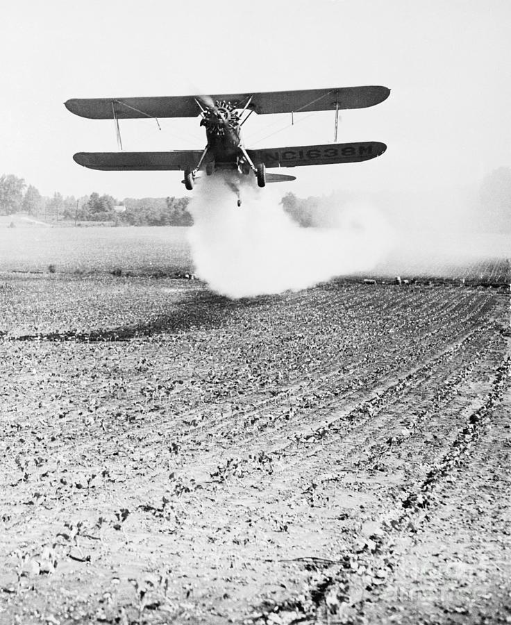 Bi-plane Dusting Field With Pesticides Photograph by Bettmann