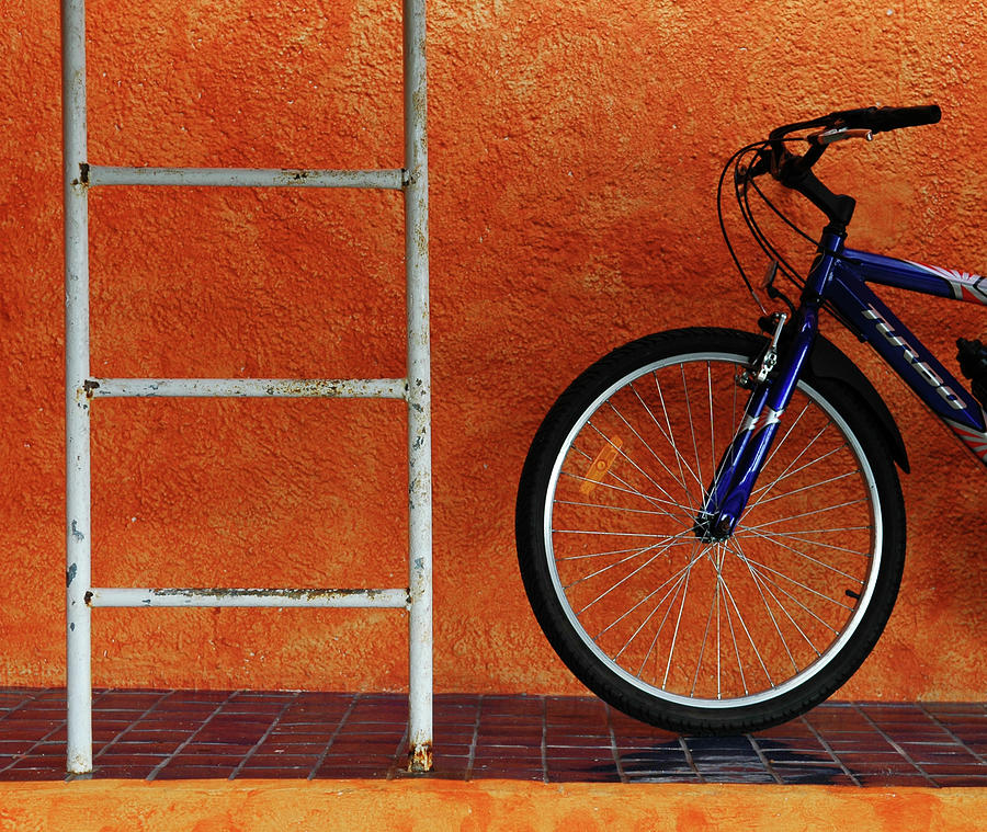 Bicycle Against Orange Wall Photograph by Dlewis33