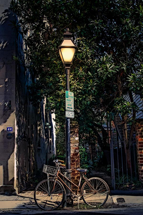 Bicycle Chained to Black Lamp Post Photograph by Darryl Brooks