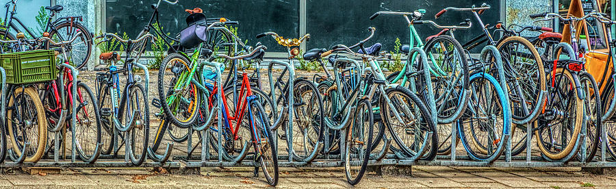 Bicycles in Amsterdam  Photograph by Debra and Dave Vanderlaan