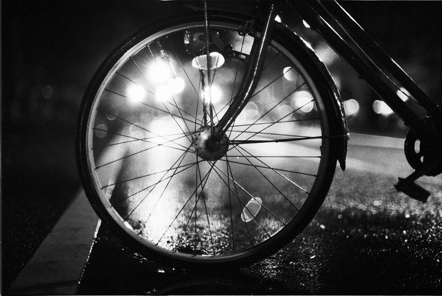 Bike Wheel In Night Rain Photograph by Breeze.kaze
