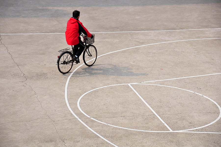 Biker On The Basketball Court Photograph by Margareta Lindeman