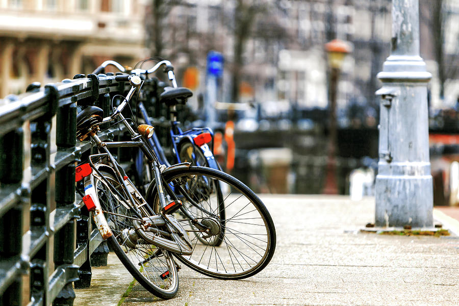 Bikes on the Bridge in Amsterdam Photograph by John Rizzuto