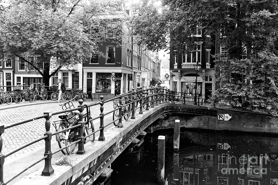 Bikes on the Canal Bridge in Amsterdam Photograph by John Rizzuto