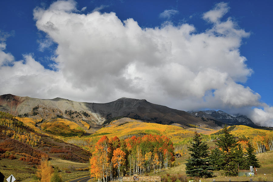 Billowing Clouds over Mountain Village Fall Colors Photograph by Ray Mathis