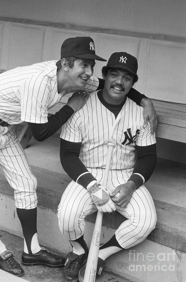 New York Yankees' Reggie Jackson is greeted at the dugout after