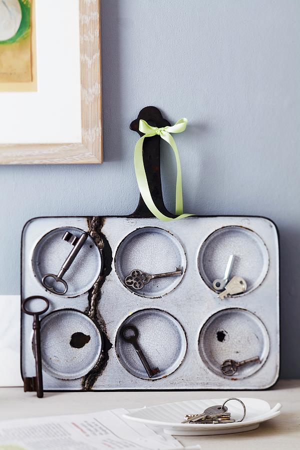 Bin Tin Used As Key Rack Photograph by Franziska Taube