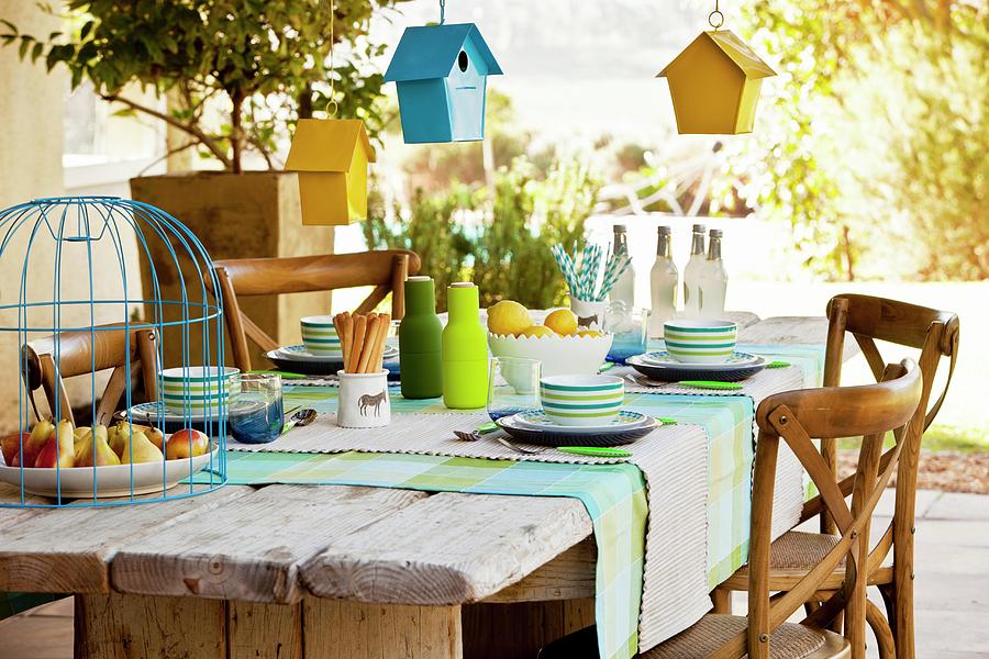 Bird Houses Hung Over Set Table Photograph by Great Stock!