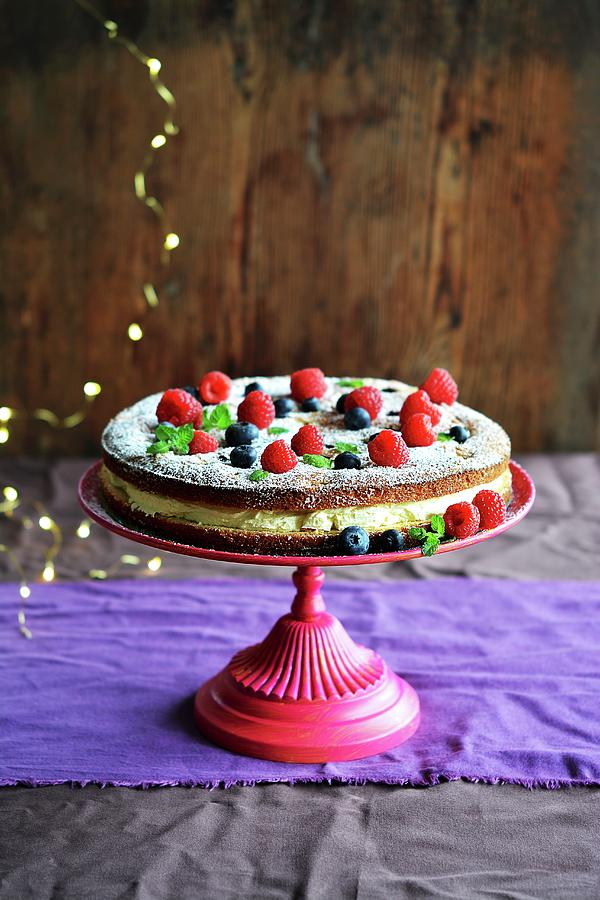 Biscuit Cake With Forest Fruits And Cream On A Stand Photograph by Mariola Streim