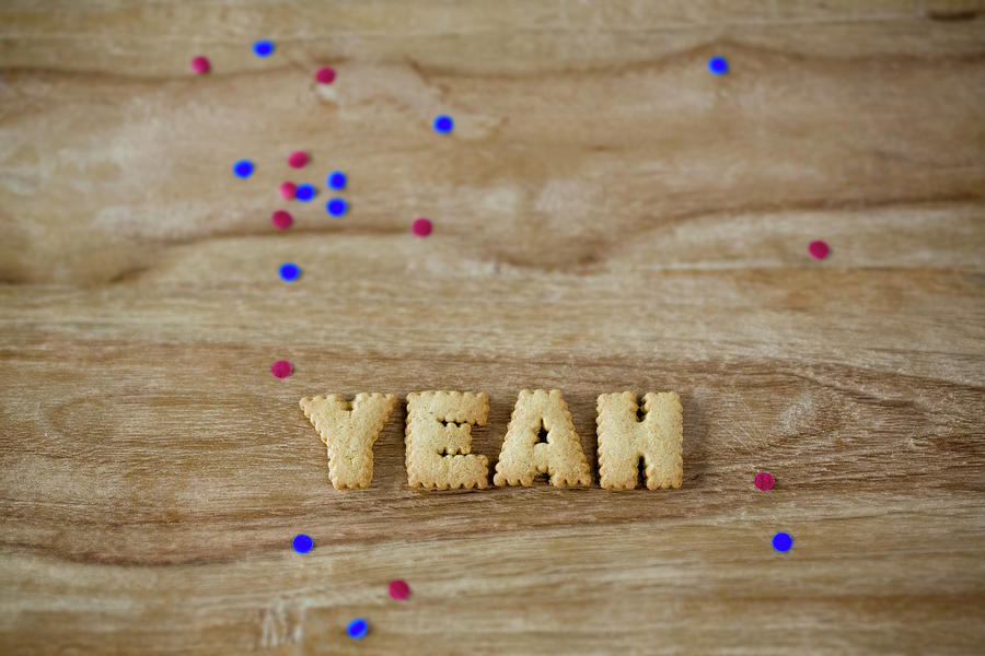 Biscuits Letters And Confetti Photograph by Jennifer Braun