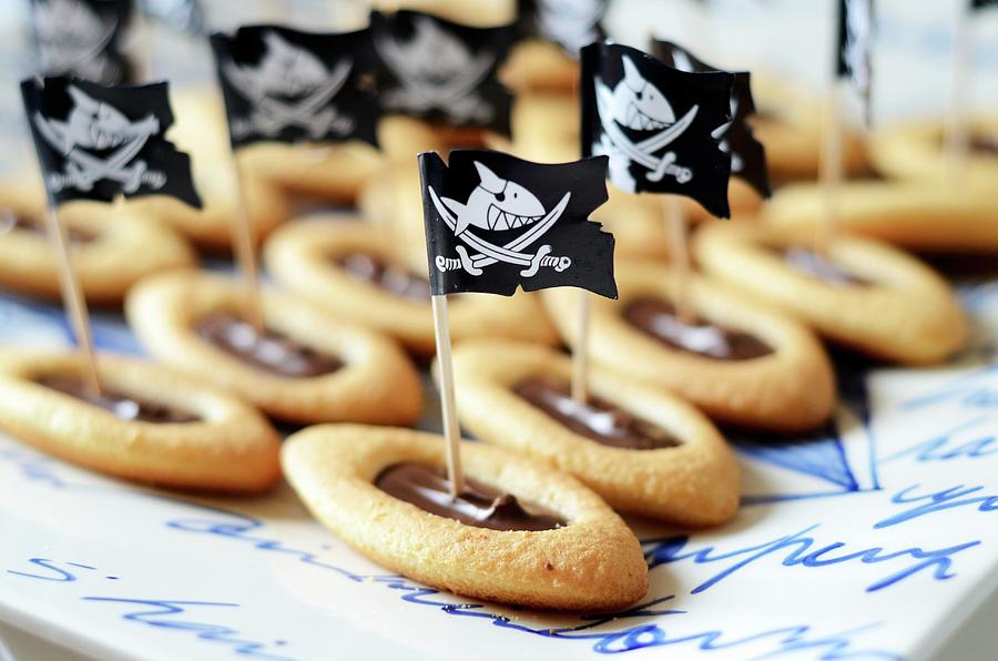Biscuits With Chocolate Ganache As Pirate Ships Photograph by Chatelain, Sonia