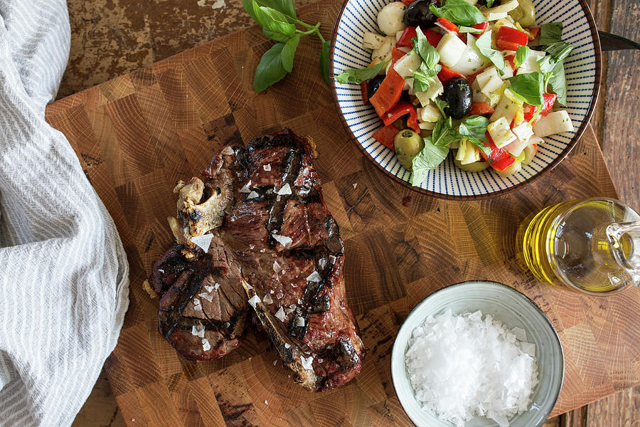 Bistecca: T-bone Steak With Olive Oil And Sea Salt Served With Salad italy Photograph by Nicole Godt