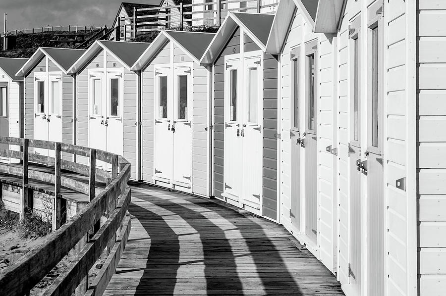 Black and White Bude Beach Huts Photograph by Helen Jackson