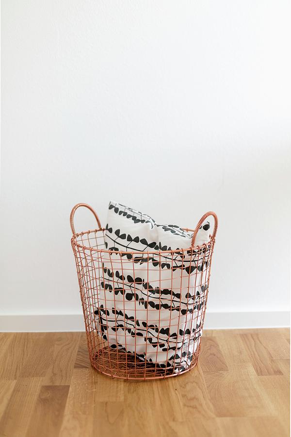 Furniture Photograph - Black And White Cushion In Copper-coloured Wire Basket by Wiener Wohnsinn