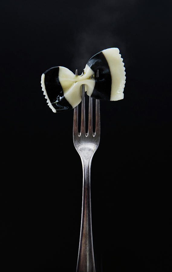 Black And White Farfalle Pasta On A Fork Photograph by Olga Berndt