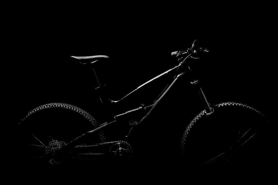 Black And White Mountain Bike In Studio Photograph by Stuart Ashley