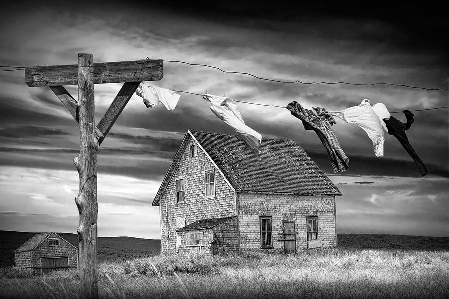 Black And White Of Laundry On The Line By Boarded Up House Photograph