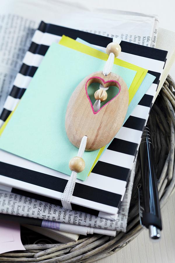Black And White Striped Notebook With Wooden Beads Threaded Onto Elastic Strap Photograph by Franziska Taube