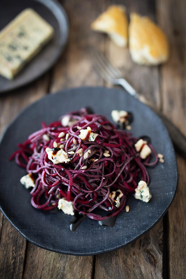Black Bean Noodles With Beetroot And Blue Cheese Photograph by Jan Wischnewski