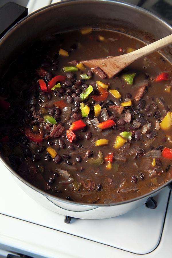 Black Bean Stew With Chipotle In A Pot On A Stove Photograph by Katharine Pollak