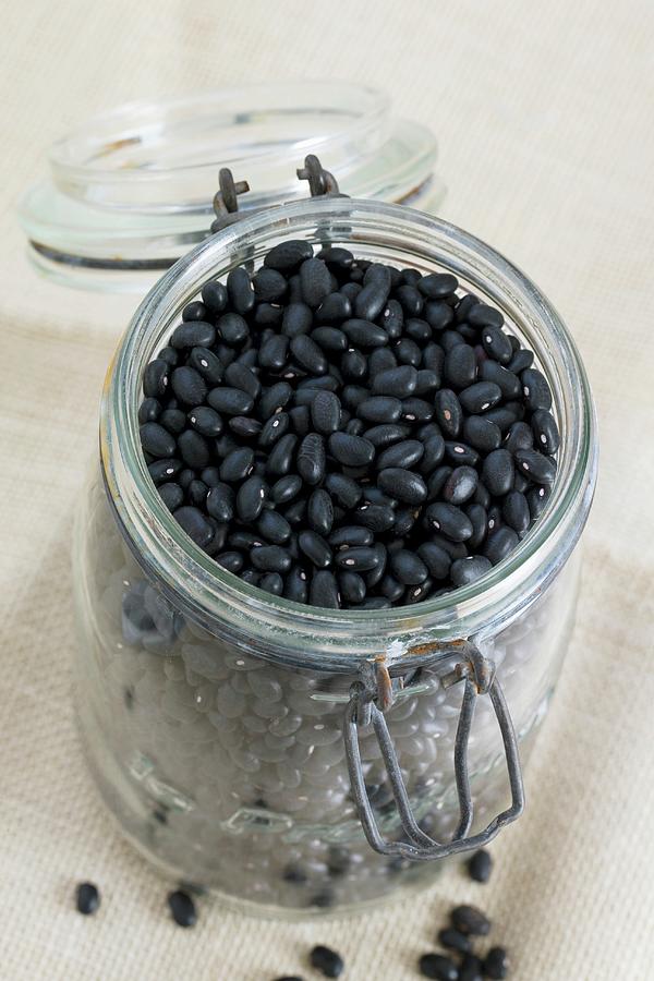 Black Beans In A Storage Jar Photograph by Lydie Besancon