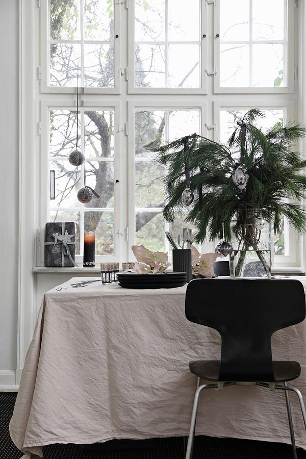 Black Chair At Festively Decorated Table With Pale Tablecloth Photograph by Lykke Foged & Morten Holtum