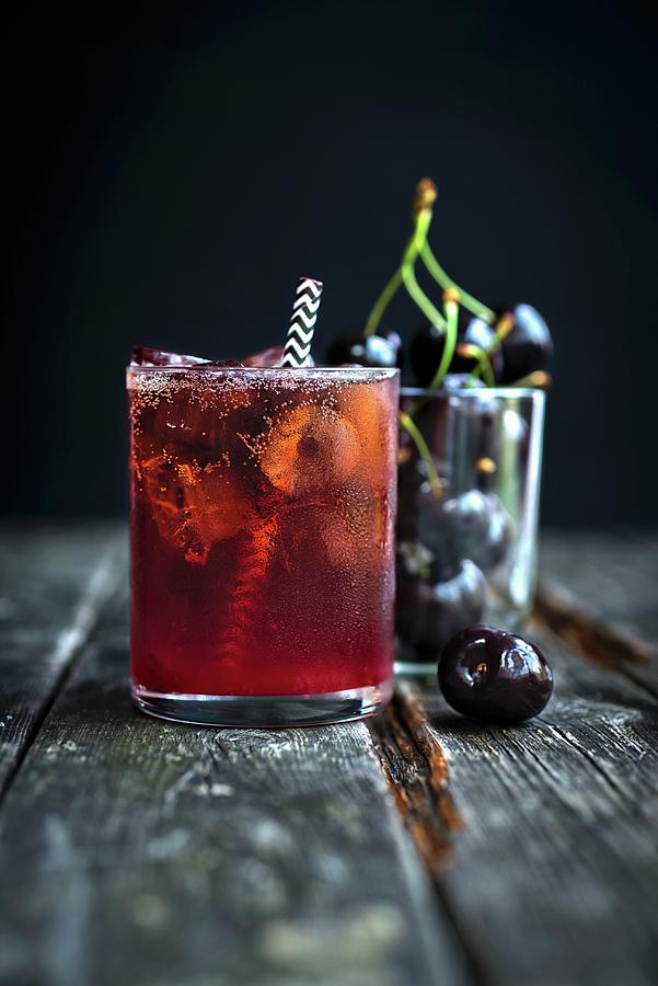Black Cherry Bourbon Smash Cocktail Photograph by Lucy Parissi
