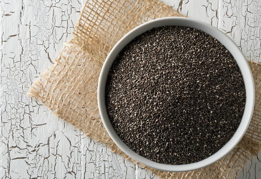 Black Chia Seeds In A Bowl On A Rustic Wooden Table Photograph by Shawn Hempel