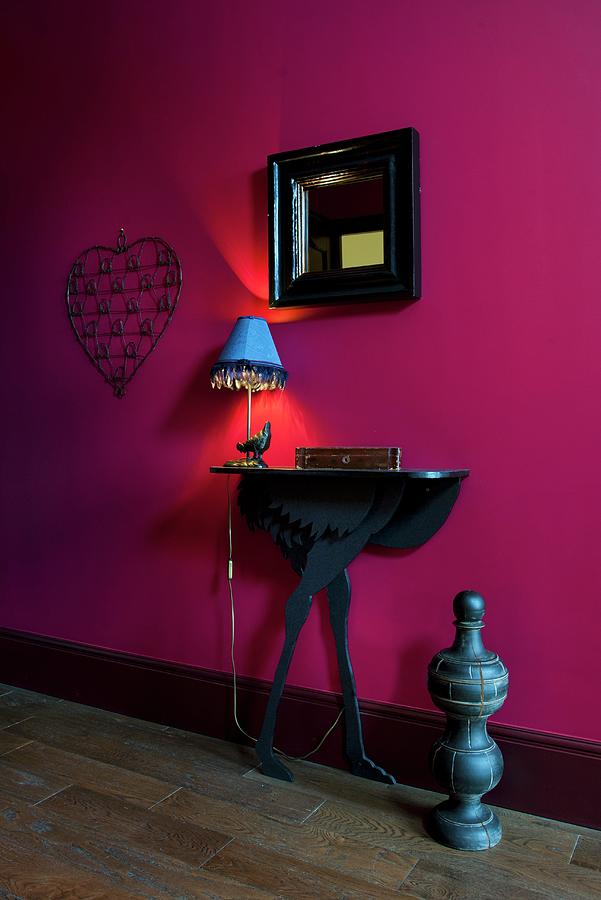 Black Console Table And Mirror On Magenta Wall Photograph by Christophe Madamour