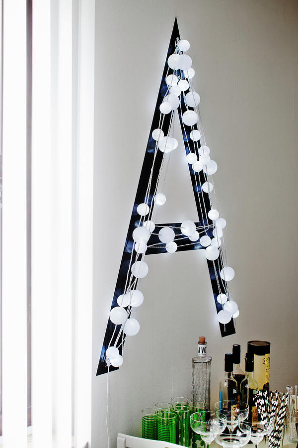 Black Decorative Letter With White Fairy Lights Photograph by Lina stling