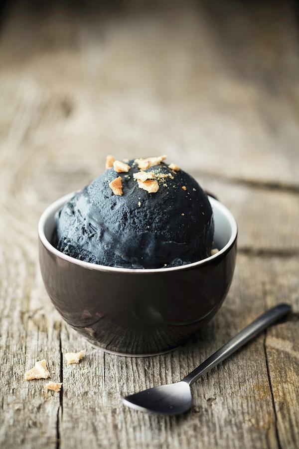 Black Egg With Vanilla rice Pudding Photograph by Jan Wischnewski