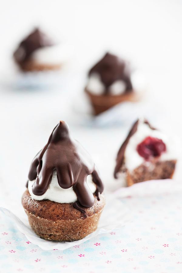 Black Forest Gateau Kisses chocolate Muffins With Cherries, A Whipped Egg White Topping And Chocolate Glaze Photograph by Ina Peters