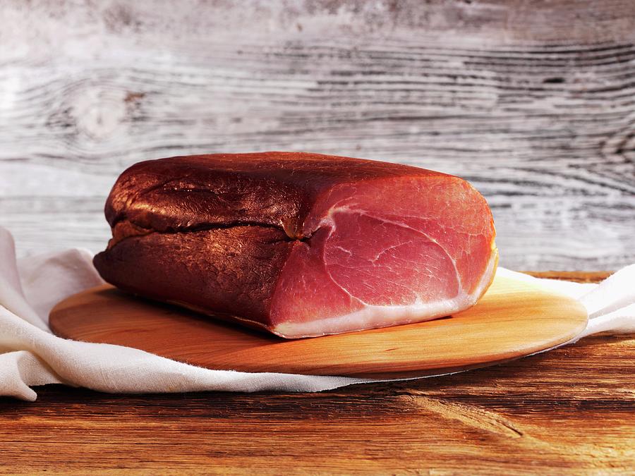 Black Forest Ham On A Wooden Board Photograph by Karl Newedel