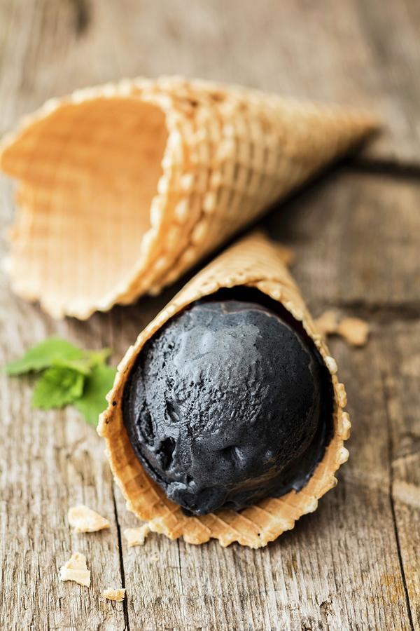 Black Ice Cream With Vanilla Photograph by Jan Wischnewski
