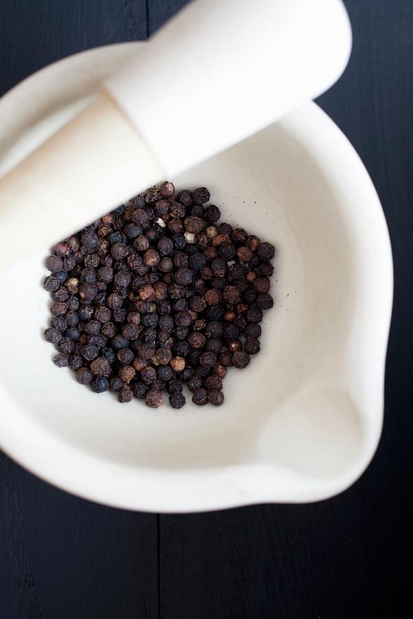 Black Peppercorns In A Mortar Photograph by Harley, Victoria